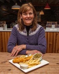 Sarah with a plate of fish and chips