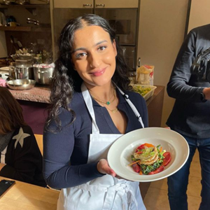 Zainab Pirzada holding up plate of food